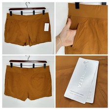 Athleta nuovo con etichette Trekkie North corto 4" cucitura interna taglia 24 marrone arancione tempo libero NUOVO