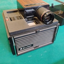 BELL  HOWELL SLIDE CUBE PROJECTOR MODEL 981Q Very Clean AMP AND FAN TURN ON