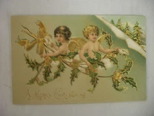 VINTAGE EMBOSSED CHRISTMAS POSTCARD ANGELS IN CLOUDS W/HOLLY 1914
