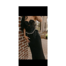 Black Strapless Formal Gown with Bow and Bead Details