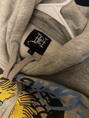 ★送料・関税込み★【Ed Hardy】Yellow Hair Skull フーディ Ed Hardy Yellow Hair Skull Grey Hoodie | Zumiez