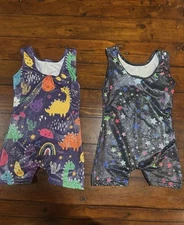 Two Leotards/Bodysuits one with dinosaurs and other with stars. Girl Child