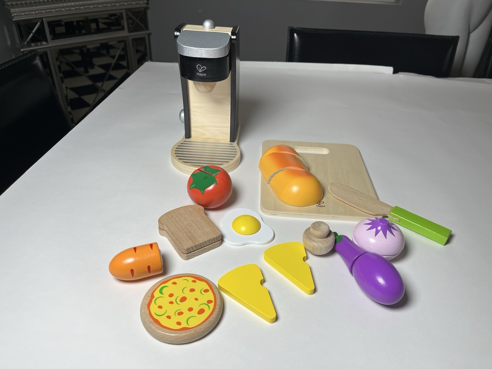 Kids hape chefs choice pretend food. Coffee maker,  veggies, eggs and bread.