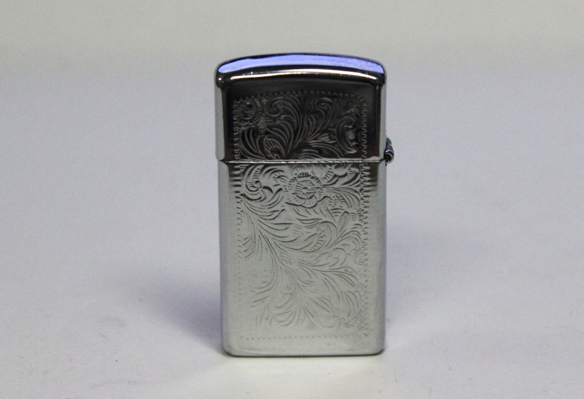 Vintage Flip-Top Zippo Venetian Chrome VIII Engraved