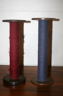 2 VINTAGE WOODEN SPOOLS/SPINDLE/TEXTILE W/RED AND BLUE THREAD. 13'' &13.5'' TALL