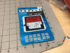 vintage PUZZLE plas-trix IQ Word puzzle - slide, on card, melt marks