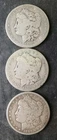 1882 S, 1883 O, and 1887 O $1 Morgan Silver Dollars