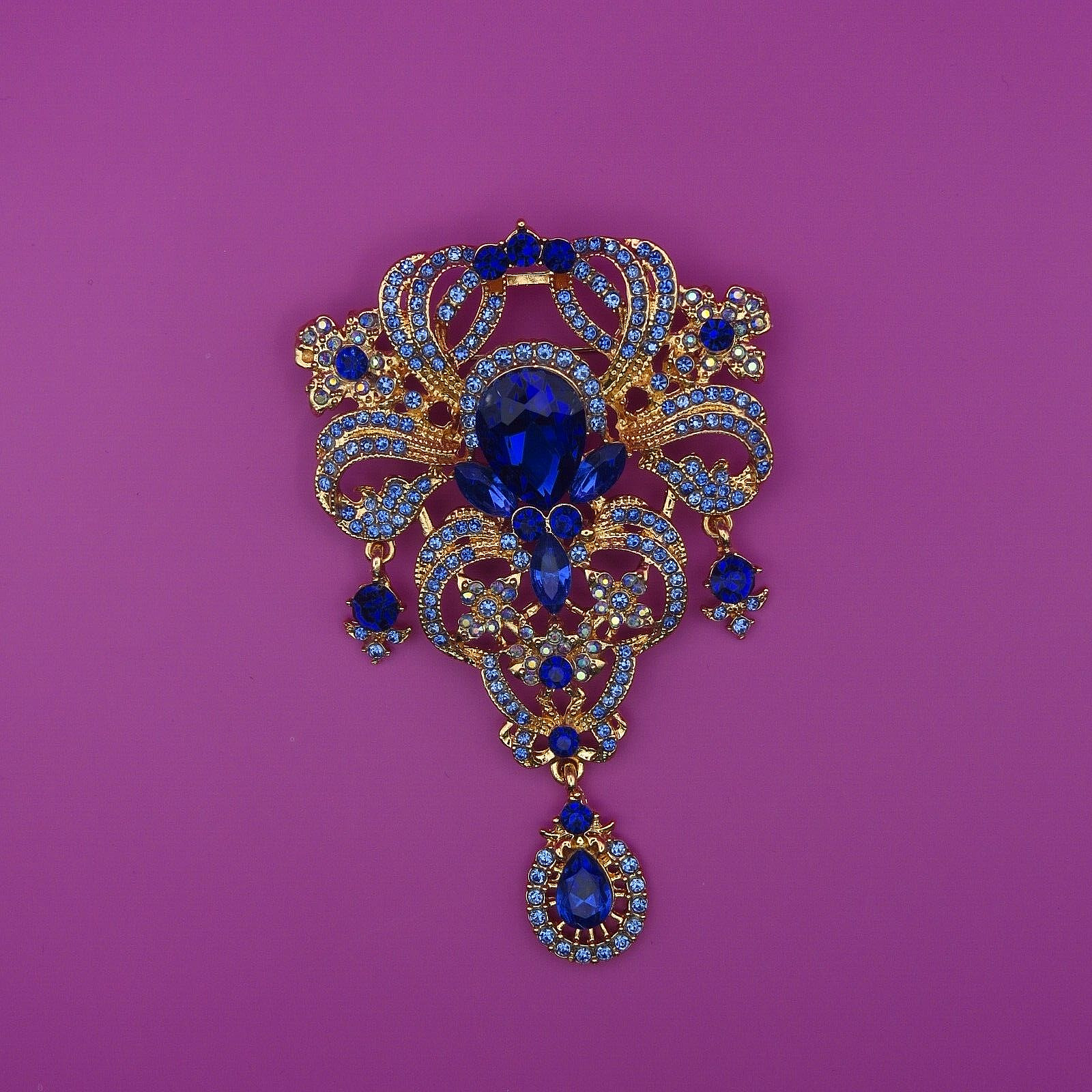 Damen Brosche Modeschmuck mit herrlichen blauen Steinen und Goldumfassung
