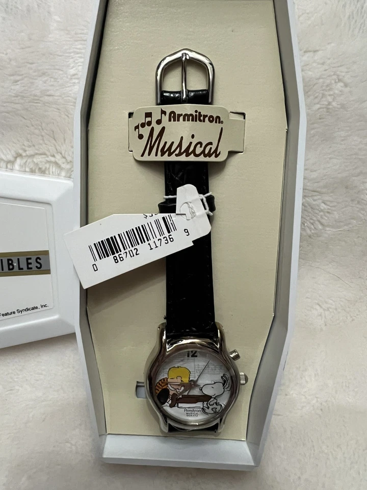 Reloj Musical Peanuts Snoopy & Linus de Armitron - Correa de Cuero Negro - Necesita batería Foto 2 de 4