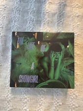 BRAND NEW THE LIFE OF A SHOWGIRL IT’S RAPTUROUS DELUXE CD TAYLOR SWIFT IN HAND