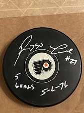 REGGIE LEACH AUTOGRAPHED FLYERS PUCK W/COA 5 GOALS 5-6-76 INSCRIPTION