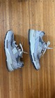 Grey New Balance 992 mens size 9 with silver “N” logo, white laces, and textured Moonrock grey on wooden floor.