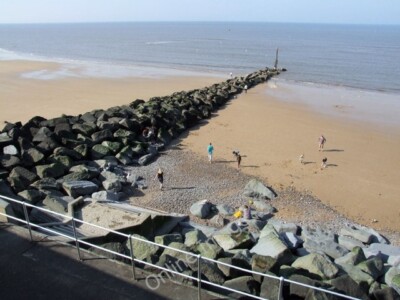 Photo 6x4 Seafront, Sheringham Groynes formed with large boulders. Just v c2010
