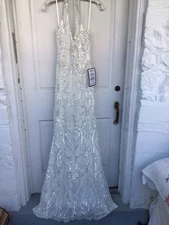 B. Darlin NWT’s White Sequin Halter Sleeveless Gown Size 3/4, Macy’s $149.00.