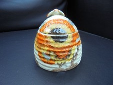 A Clarice Cliff small size beehive honey pot in RHODANTHE pattern