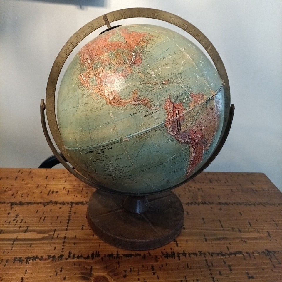 A 1940s Replogle Precision tabletop globe — 'Made in USA' from the wartime era with cartographic detail that predates the modern geopolitical map.