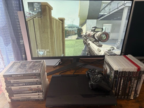 Sony PlayStation 3 PS3 Super Slim black 500GB  with 19 games 