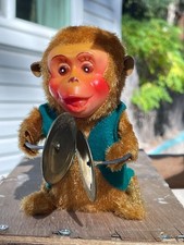 Vintage wind-up musical clockwork monkey with cymbals
