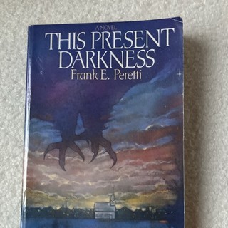 This Present Darkness by Frank E. Peretti (2003 Trade Paperback)