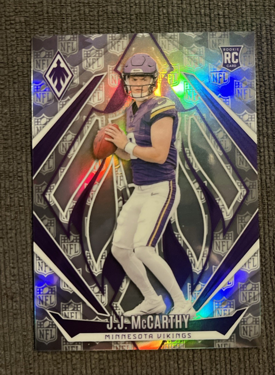 2024 Panini Phoenix - Rookies J.J. McCarthy #185 NFL Shield /150 (RC)