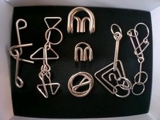 Lot of 7 Metal Wire Brain Teaser Puzzles Mind...
