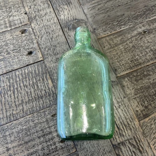 Vintage Green Glass Bottle Raised writing federal law prohibits indescription￼ ￼