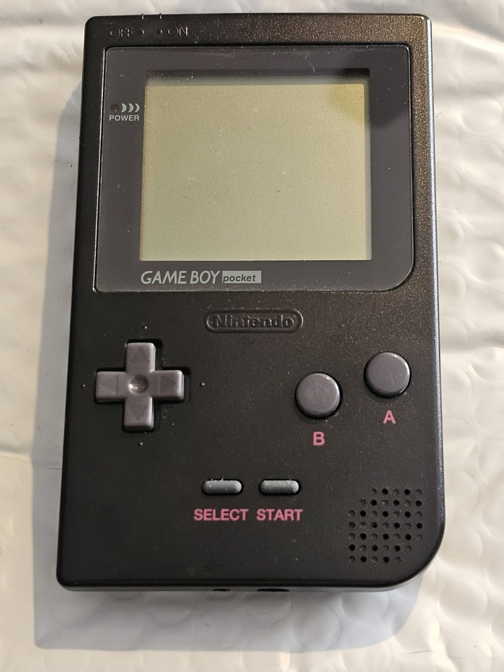 The iconic slim Game Boy Pocket in black — a tested, working piece of 90s handheld history that still plays every classic GB cartridge.
