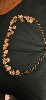 vintage gold-tone coin necklace or belly chain featuring decorative link details