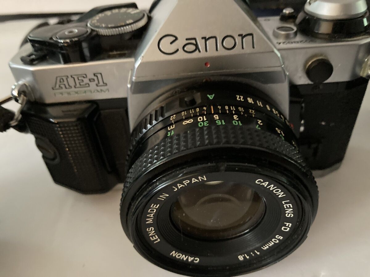 Canon AE-1 Program 35mm Camera 1984 Olympic Games Lens Cap Canon AE-1 Program 35mm Camera 1984 Olympic Games Lens Cap