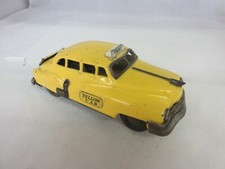 VINTAGE YELLOW CAB TIN TOY CAR FRICTION WORKS SOME G-423