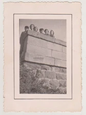 Young Spirits Above the Wall Glimpse of Laughter Curiosity and Shared Adventures