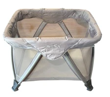 Nuna Sena Aire Play Yard Travel Bassinet With Travel Bag In Beige With Sheet