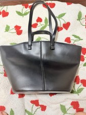 Black Tote Double Handles Stitching Accent Gold Hardware Inner Pockets