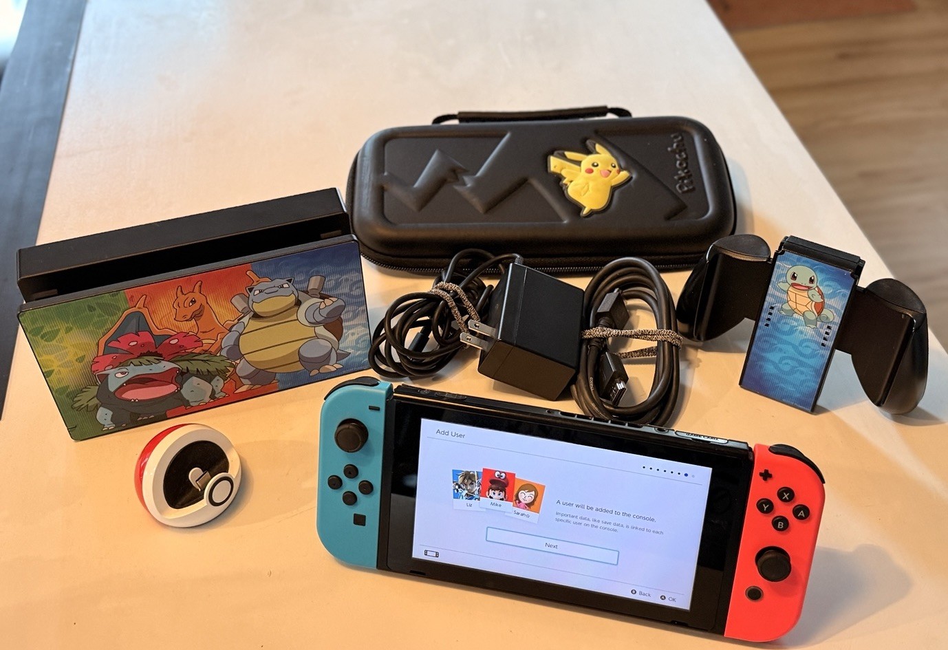 Nintendo Switch blue/red joy-cons With Pokemon Fan Extras! Gently Used.