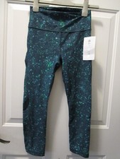 ATHLETA ULTIMATE STASH POCKET SPLAT CAPRI LEGGINGS IN OCEAN TEAL SIZE XS NEW