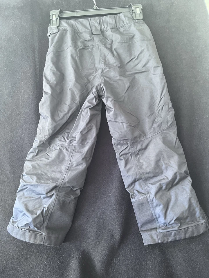 Pantalones de nieve REI cooperativos para niños talla XS (6-7) negros forrados de vellón cremalleras en el tobillo Foto 2 de 2