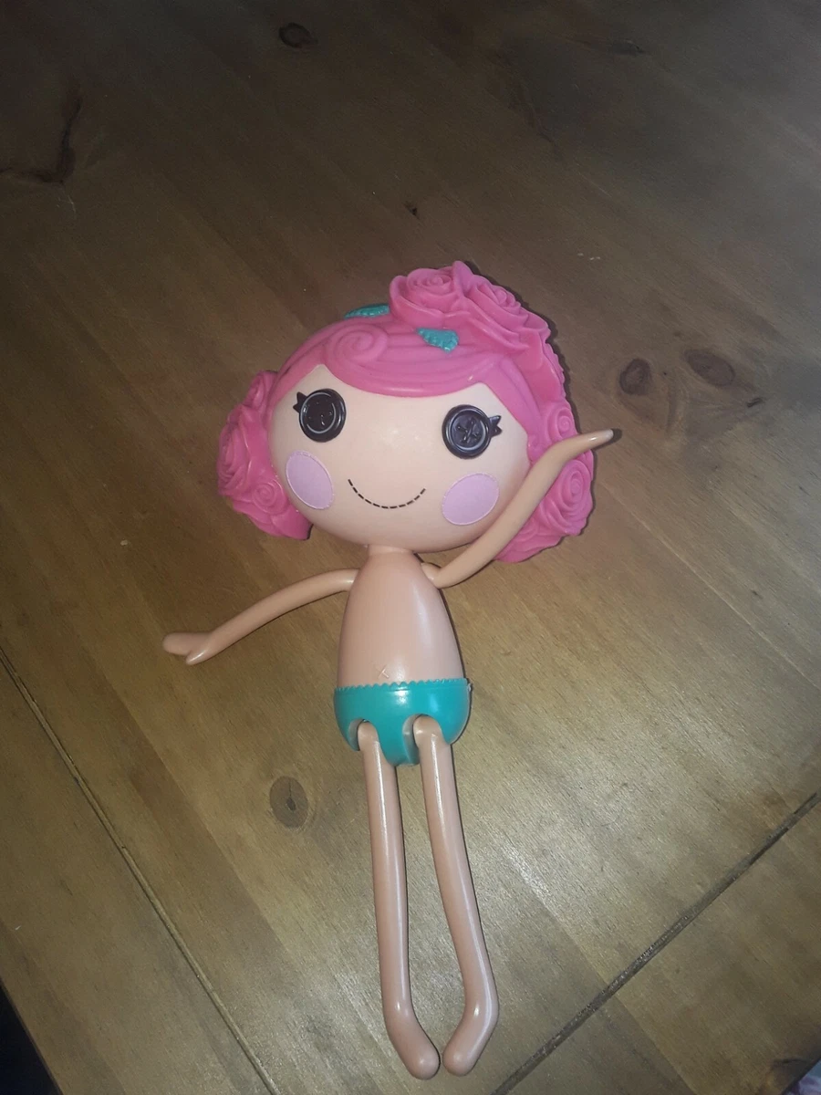 Doll with pink cheap hair and button eyes
