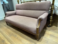 Lilac two seater sofa and footstool 