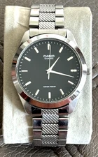 Casio MTP 1370 dress watch black face new battery 36mm Japan