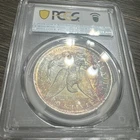 1883-O PCGS MS62 Morgan Dollar w/ Gorgeous Rainbow Toning & Amazing Eye Appeal
