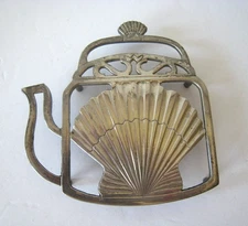 Vintage Silver Plated and Footed Teapot Shaped Trivet with Shell Design Nautical