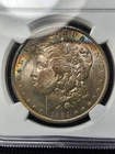 Rainbow Crescent Toned 1884-O Morgan Silver Dollar- NGC MS64