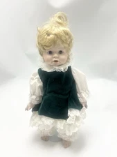 Limited Edition Blonde Porcelain Doll in Green Dress with Lace Trim. 