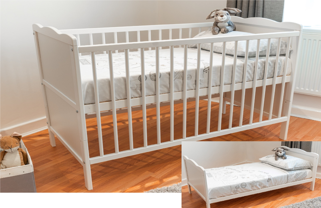 white cot with mattress