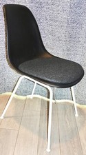 EAMES HERMAN MILLER Plastic Side Black Chair w/Cushion. NEW. Unboxed