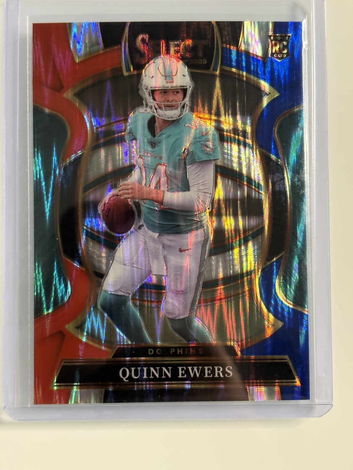 2025 Select Quinn Ewers Red And Blue Shock Prizm Rookie 82 Concourse Dolphins SP
