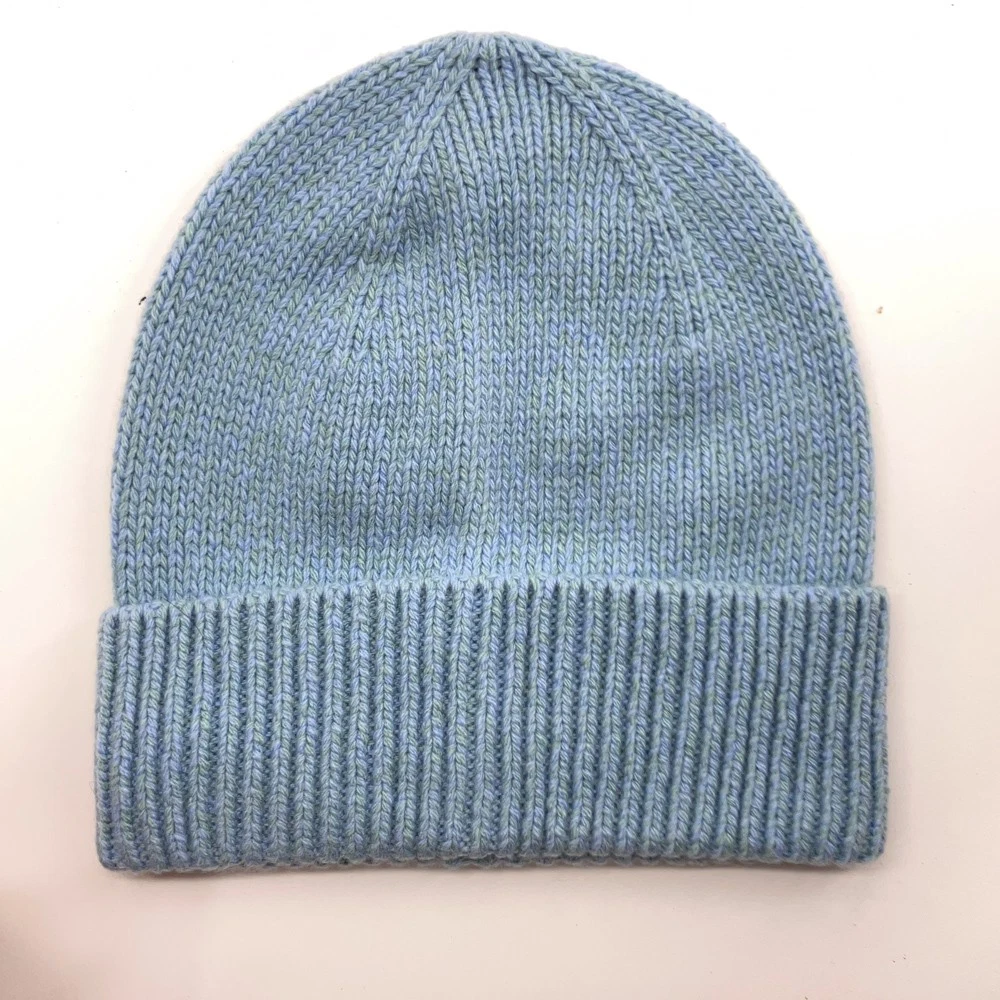 Blue Knit Winter Hat With Hints Of Green Yellow Pattern