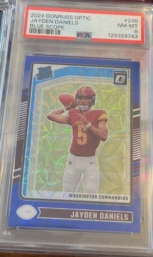 2024 Panini Donruss Optic- Rated Rookie Jayden Daniels, Blue Scope Prizm. PSA 8