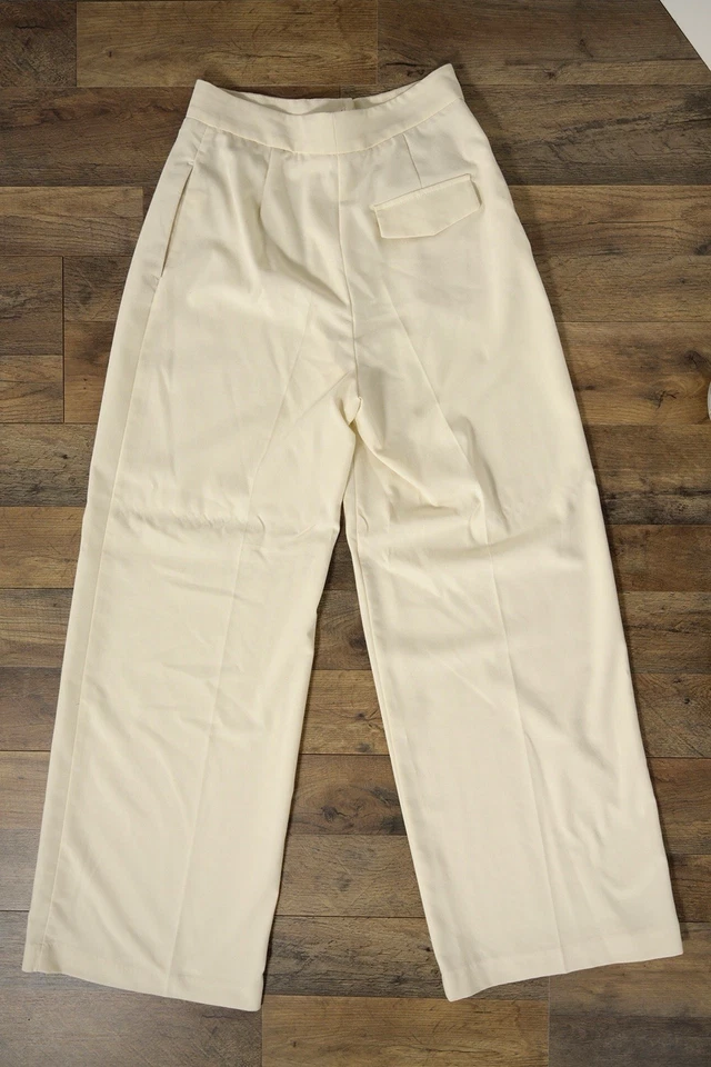Pantalones de vestir plisados de moda Zara para mujer S marfil cintura alta pierna ancha con bolsillos Foto 2 de 4