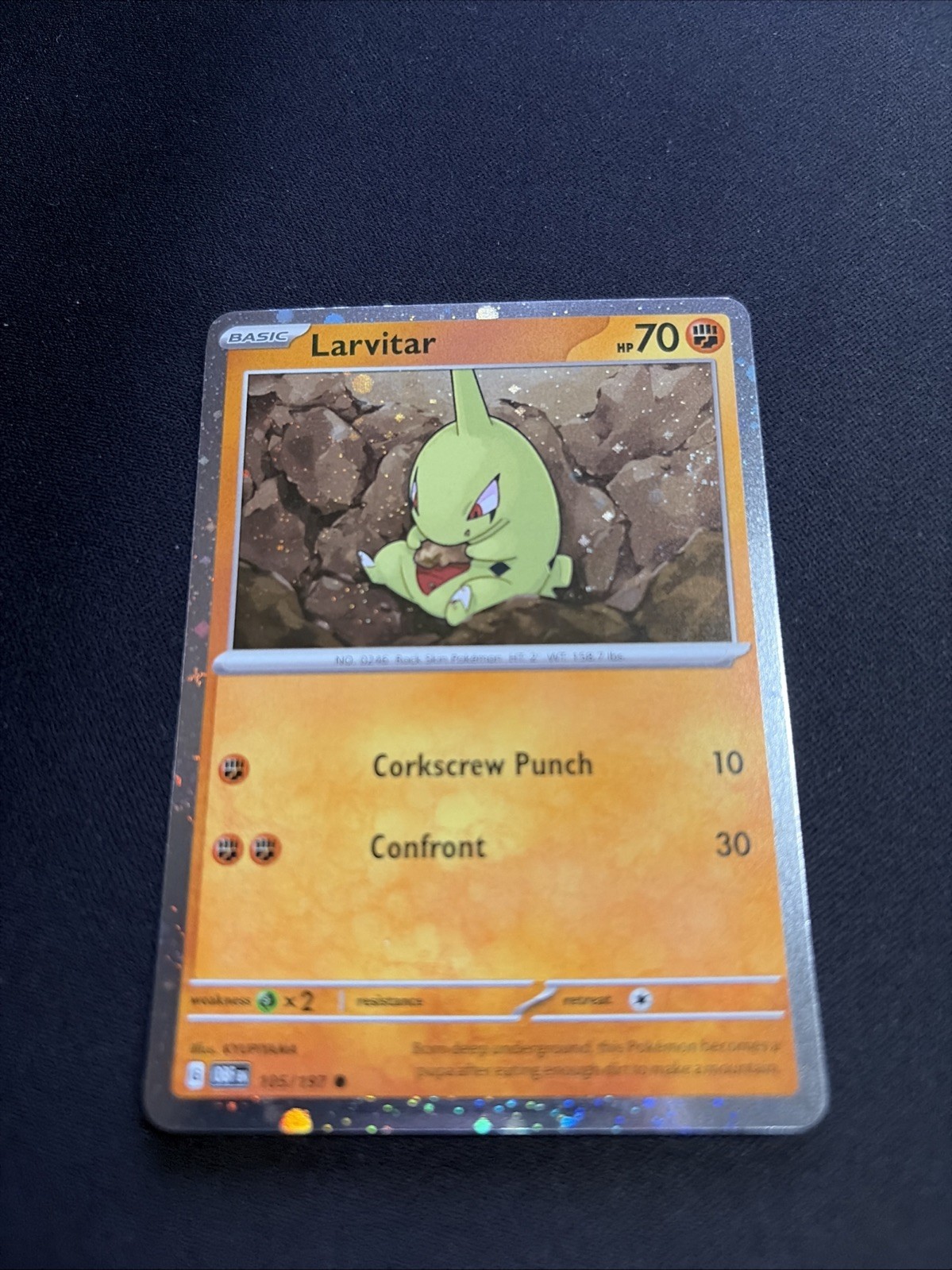Larvitar 105/197 Cosmos Holo Obsidian Flames 2023 Pokemon + swirl
